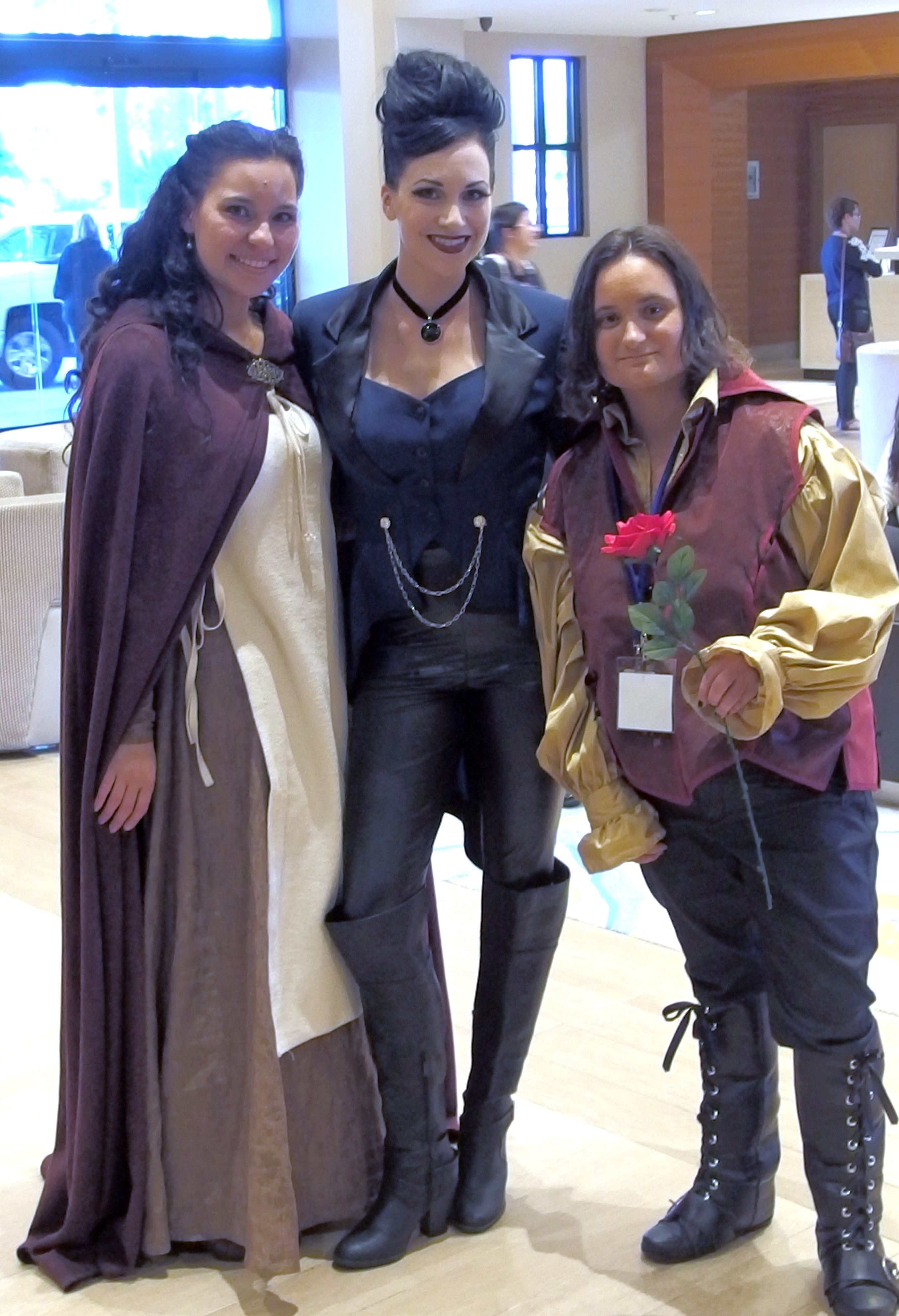 Marian, the Evil Queen and Rumpelstiltskin Cosplayers at Regal Con