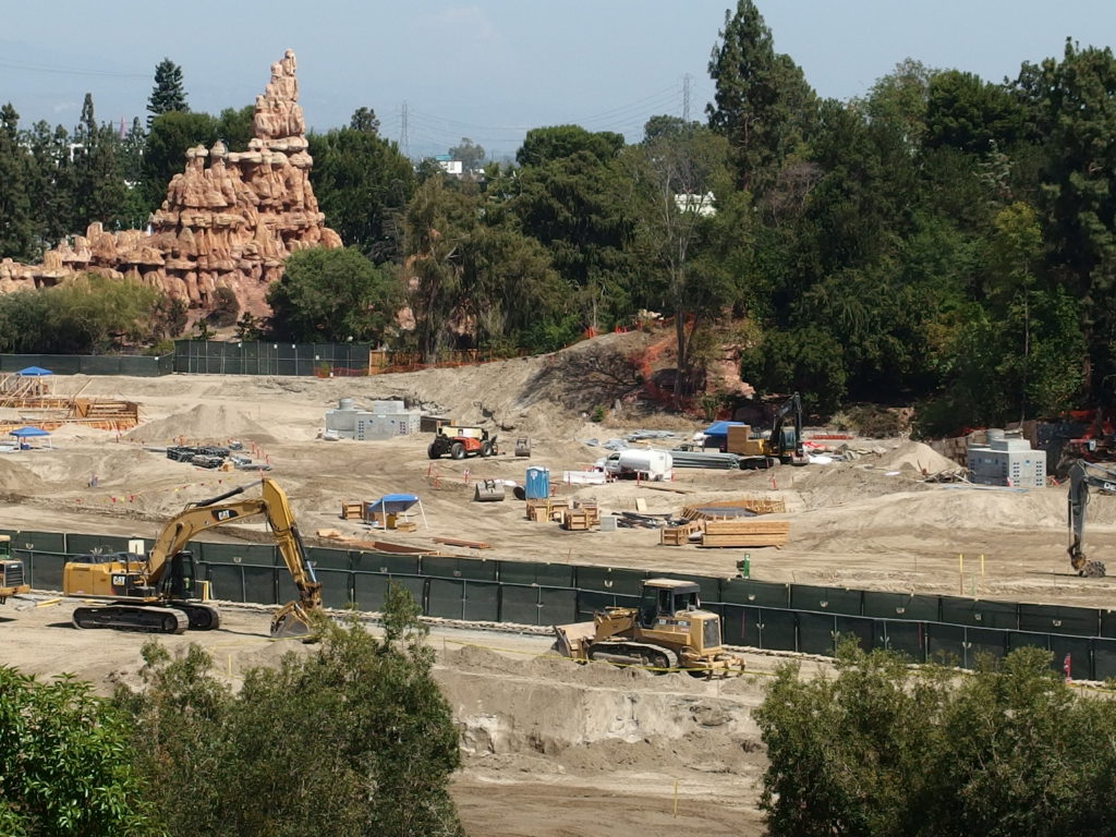 Two separate concrete structures that appear to be pump vaults can be seen