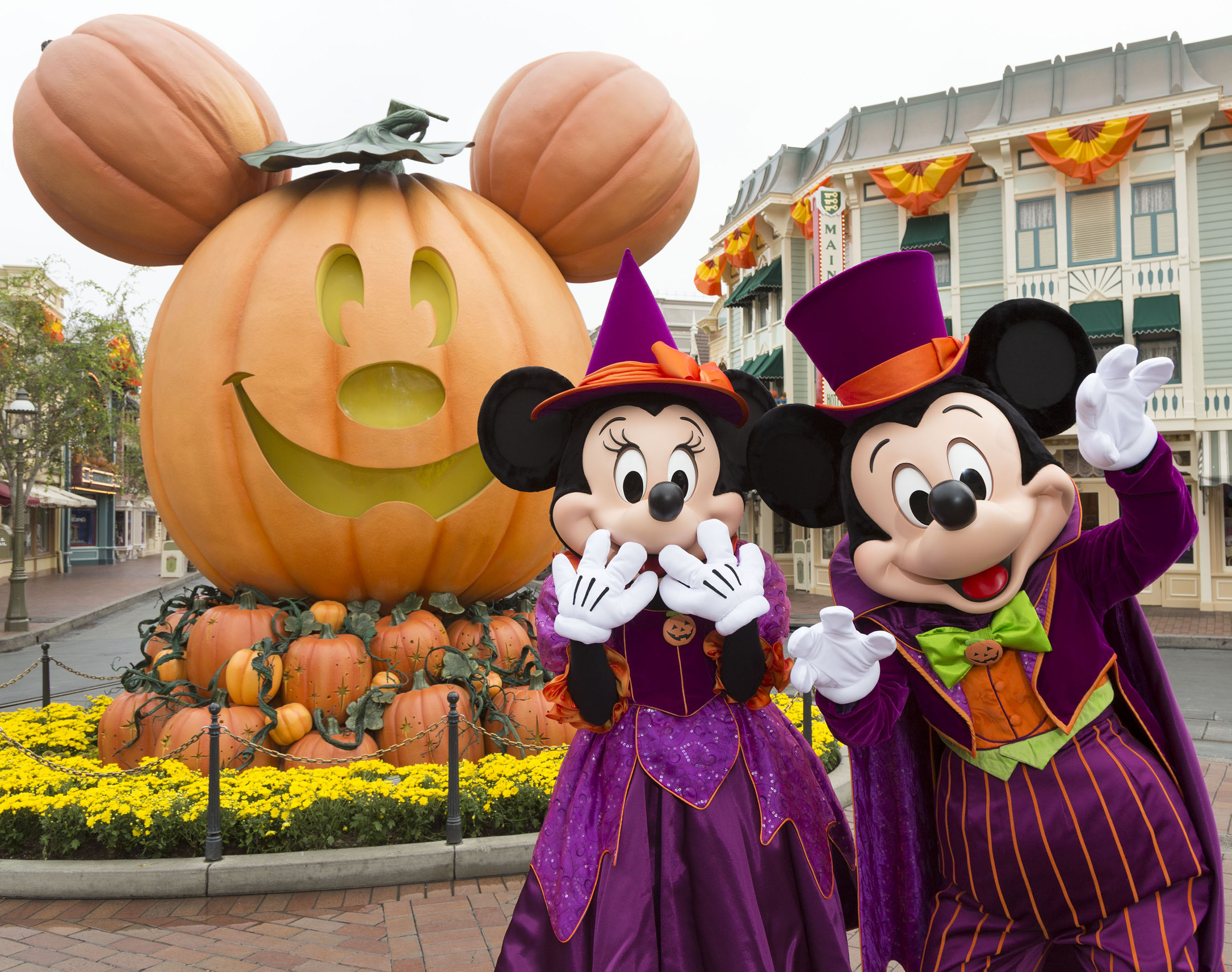 Mickey and Minnie welcome guests to Halloweentime at the Disneyland Resort