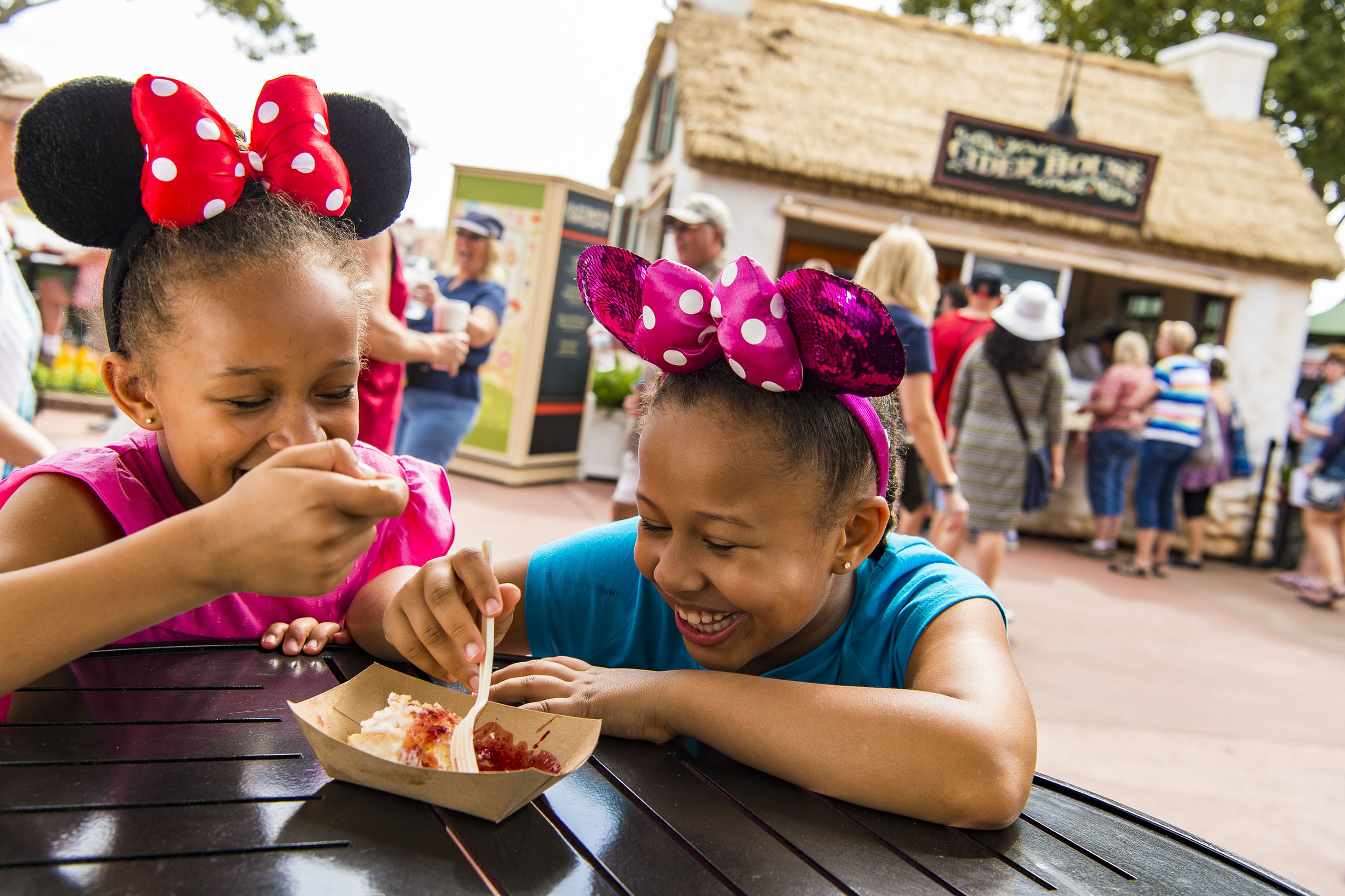 Epcot guests sample tasty bites from the Cider House Outdoor Kitchen during the Epcot International Flower & Garden Festival. The festival, which runs 90 days March 1-May 29, 2017 at Walt Disney World Resort in Lake Buena Vista, Fla., features dozens of character topiaries, stunning floral displays, gardening seminars and the Garden Rocks concert series - all included in regular Epcot admission. (Matt Stroshane, photographer)