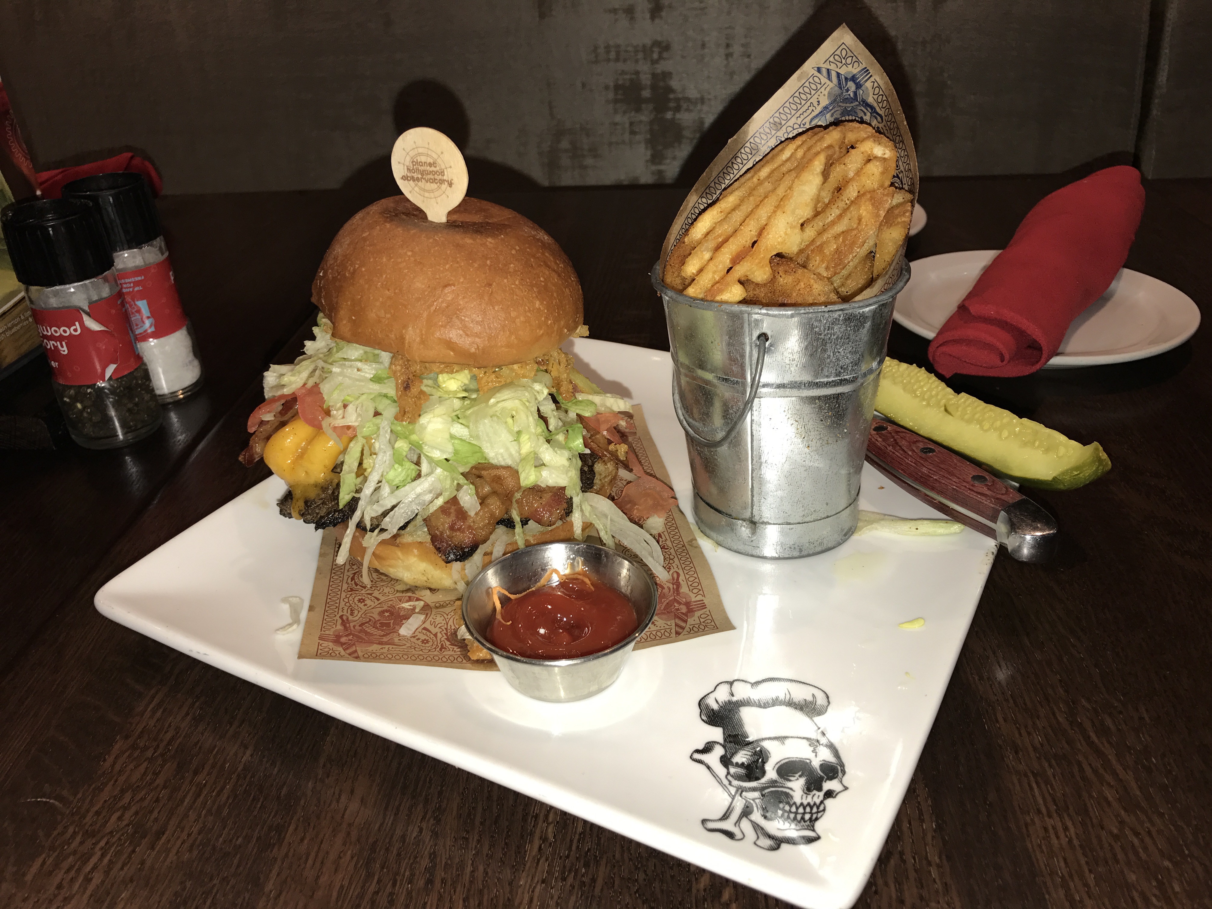 Bacon Mac-N-Cheese with applewood smoked bacon, six-cheese mac-n-cheese, cheddar, lettuce, tomato, onion, pickle, crispy onion straws, Fieri’s signature Donkey Sauce, garlic-buttered brioche bun