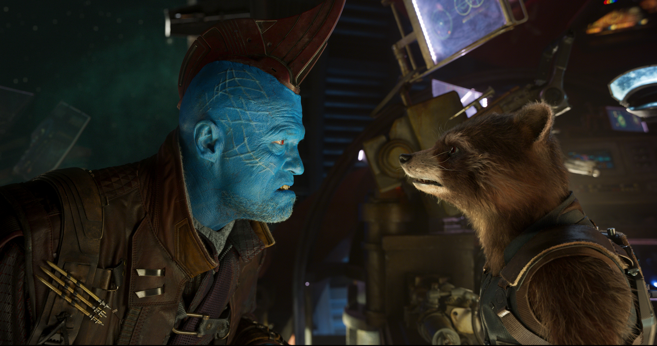 L to R: Yondu (Michael Rooker) and Rocket (voiced by Bradley Cooper).