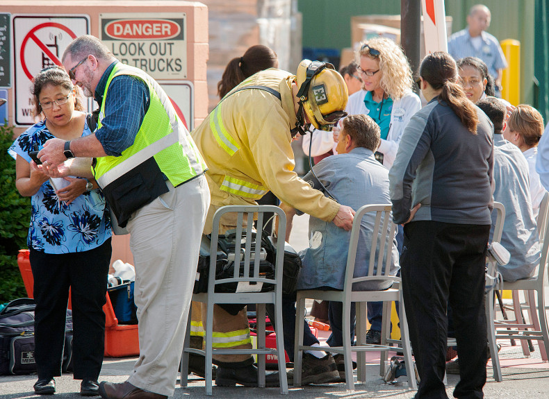 Firefighters treat employees as they respond to a possible chlorine leak outside of the Disneyland Hotel in Anaheim on Friday morning. (Photo by Ken Steinhardt, Orange County Register/SCNG)