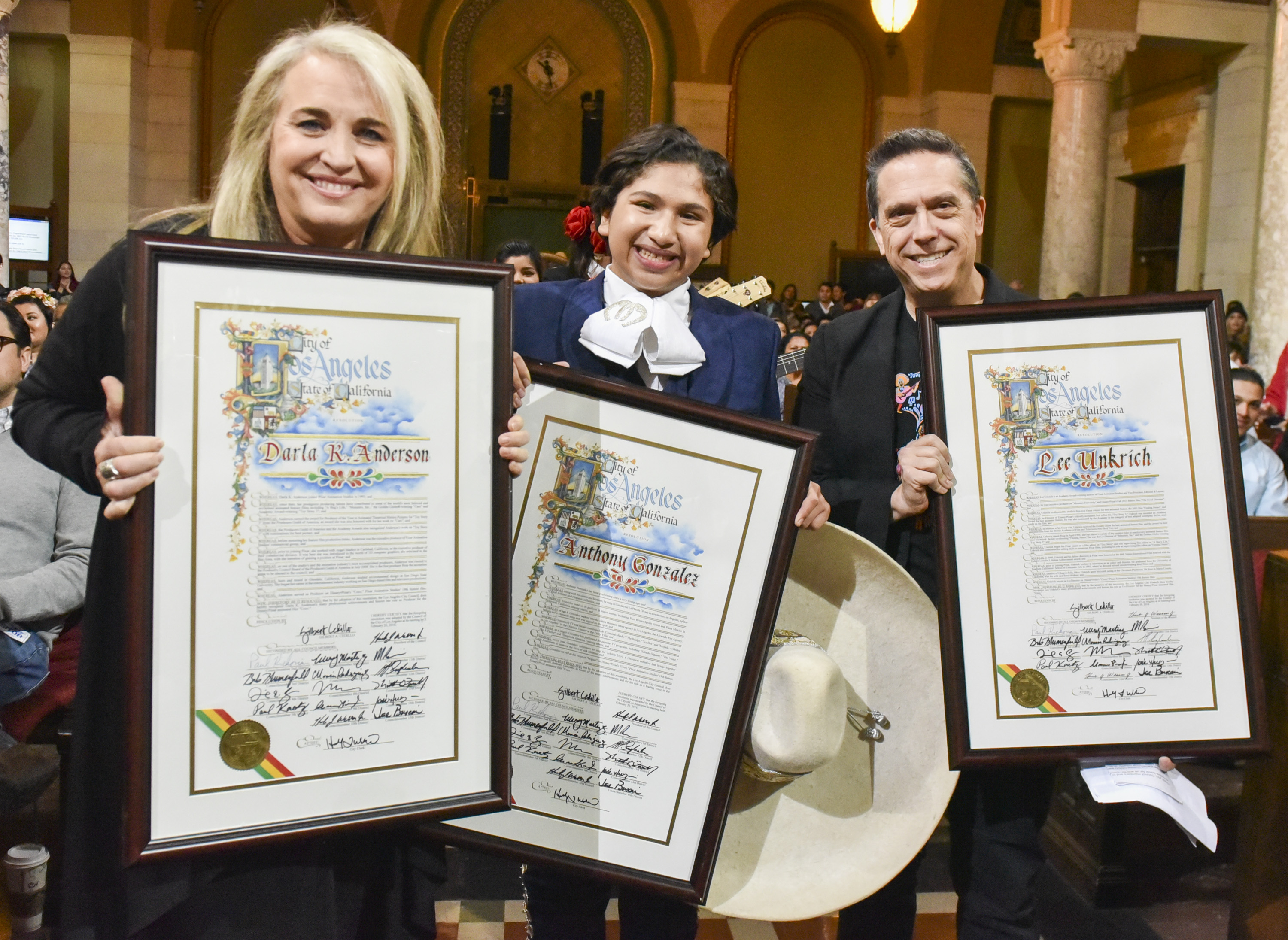 LOS ANGELES, CA - FEBRUARY 27: Producer Darla K. Anderson, Anthony Gonzalez, and Director Lee Unkrich pose for portrait as Los Angeles celebrates Disney and Pixar's 