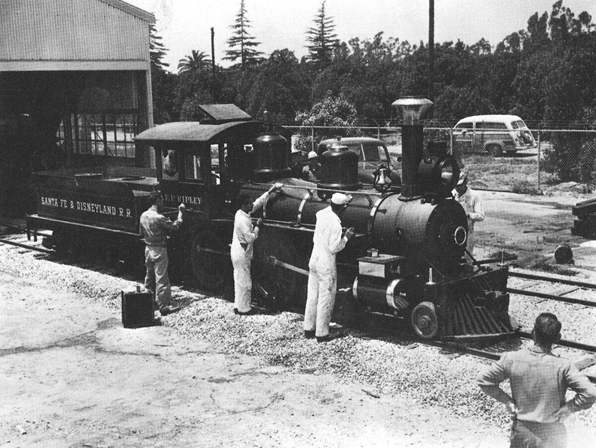 With Winston Road visible through the fence, a crew puts finishing touches on Engine #2, the E.P. Ripley.