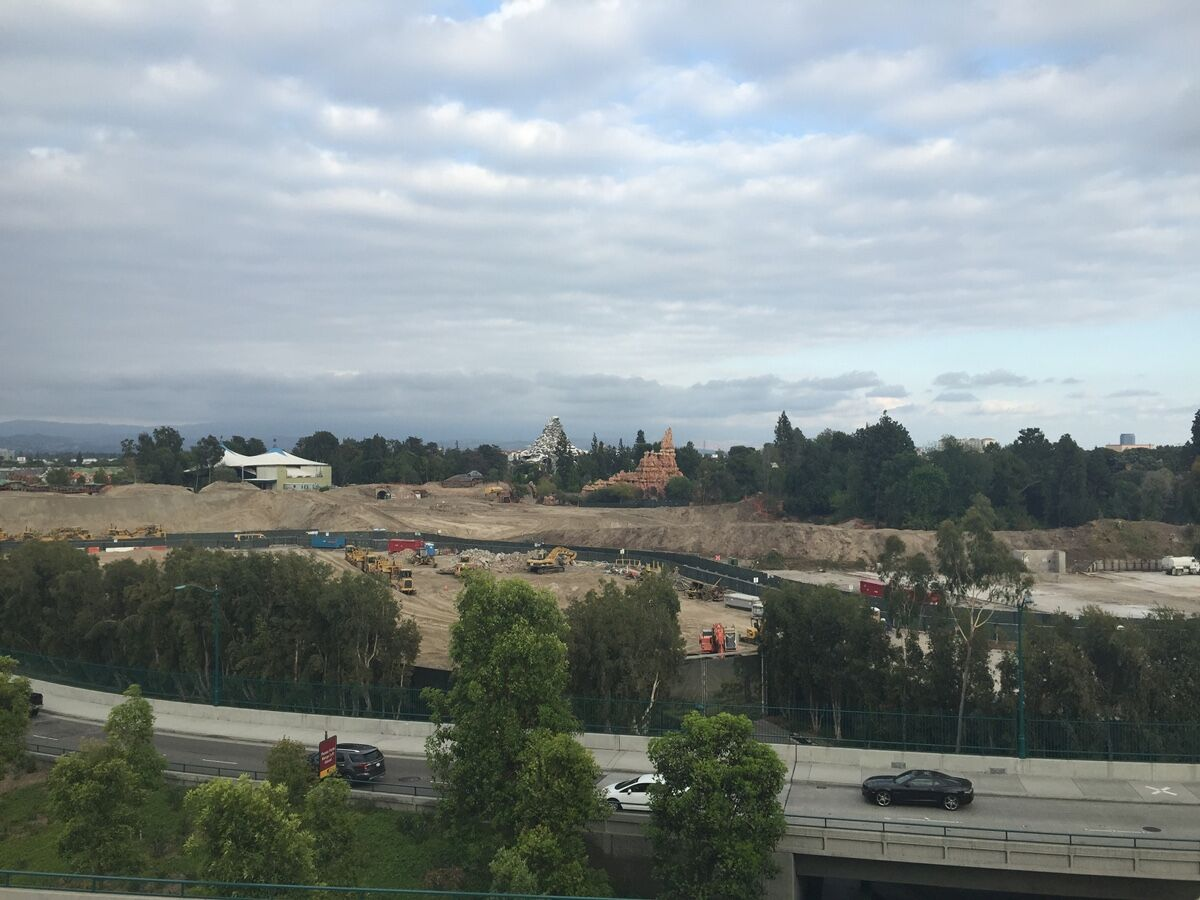 The green fence bisecting the construction site was a final vestige of the original backstage.