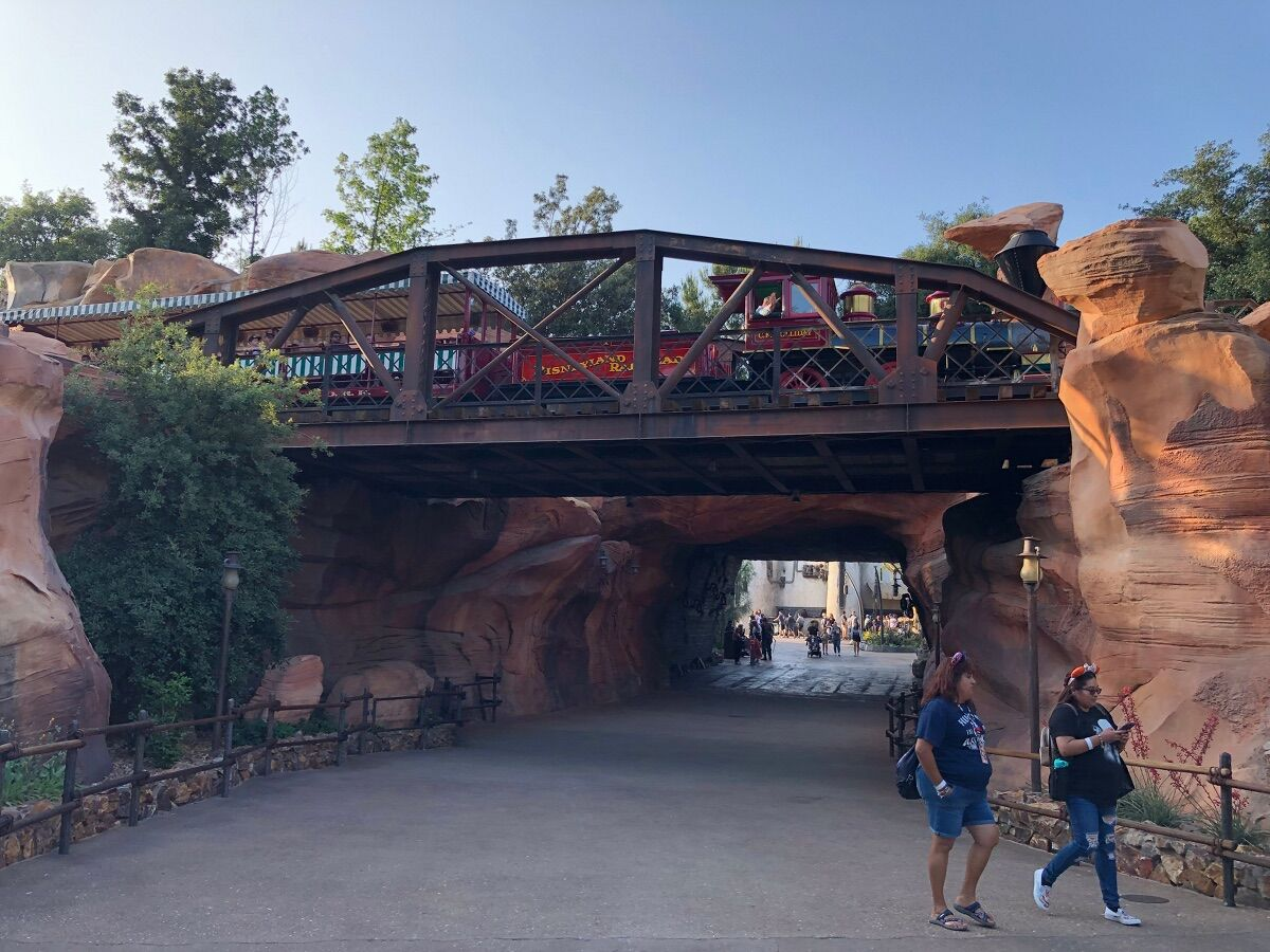 Engine #1, the C.K. Holliday, passes over one of the entrances to Galaxy’s Edge.