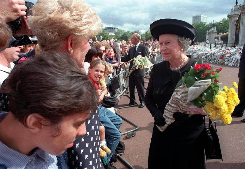 Queen Elizabeth II accepts flowers from mourners after Diana, Princess of Wales' death. September 5, 1997. (Adrian Dennis/AP/REX/Shutterstock)