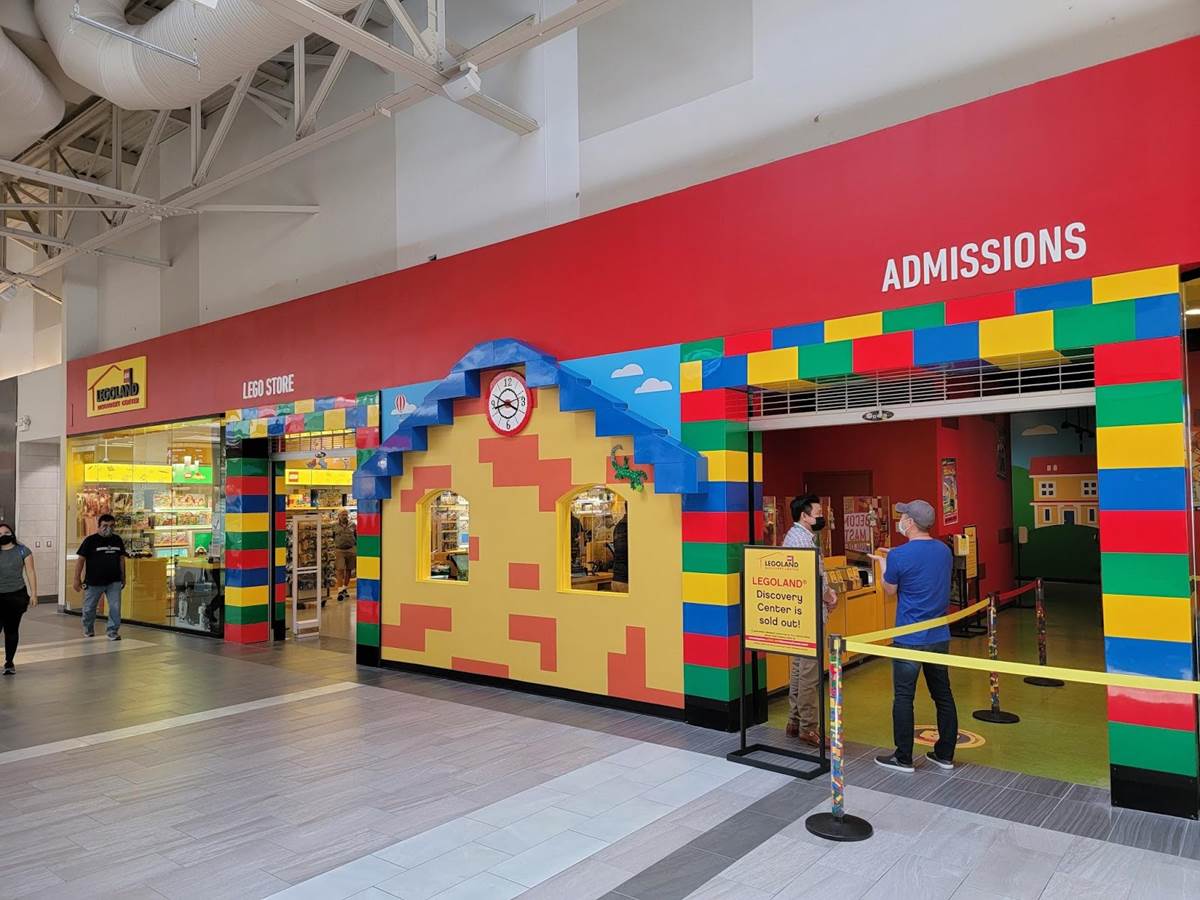 Main Entrance at the Milpitas Great Mall. Banners and signs on the mall exterior make it easy to park nearby.