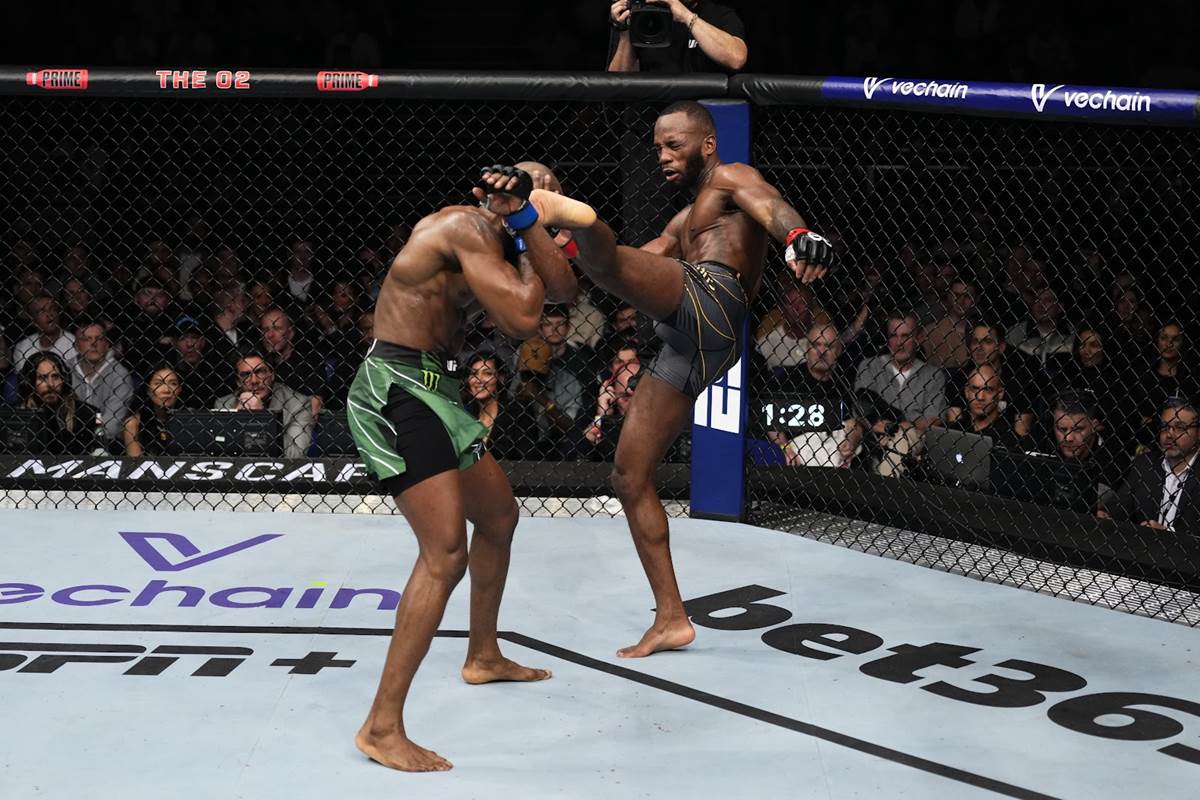 Leon Edwards lands another head kick on Kamaru Usman