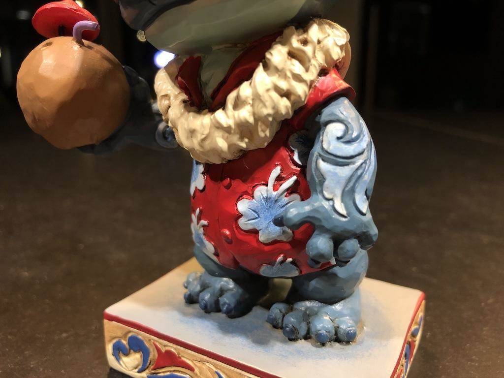 Flowery lei, Hawaiian shirt, filigree on arm, and clawed feet