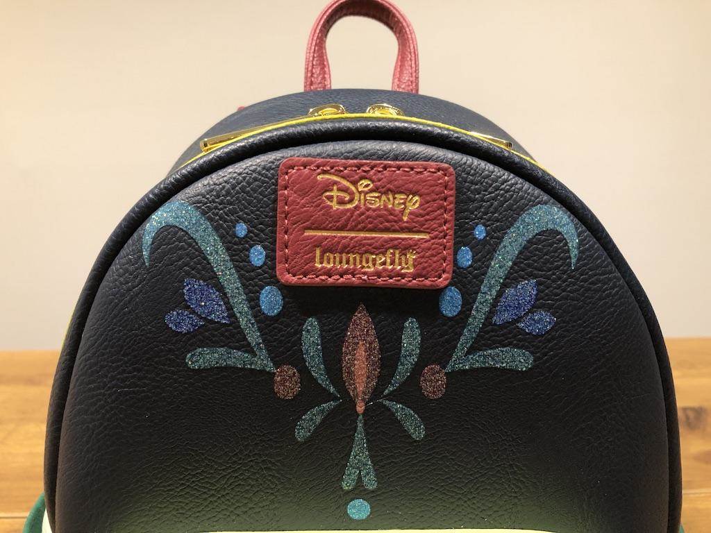 Filigree design is sparkly. Loungefly tag is faux leather.