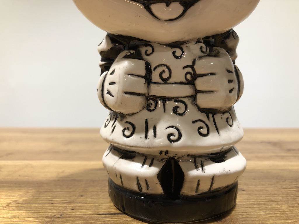 Minnie's arms are held close to her body.