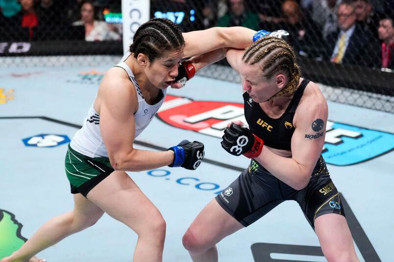 Alexa Grasso of Mexico trades punches with Valentina Shevchenko of Kyrgyzstan in the UFC flyweight championship fight during the UFC 285 event at T-Mobile Arena on March 04, 2023 in Las Vegas, Nevada. (Photo by Jeff Bottari/Zuffa LLC)