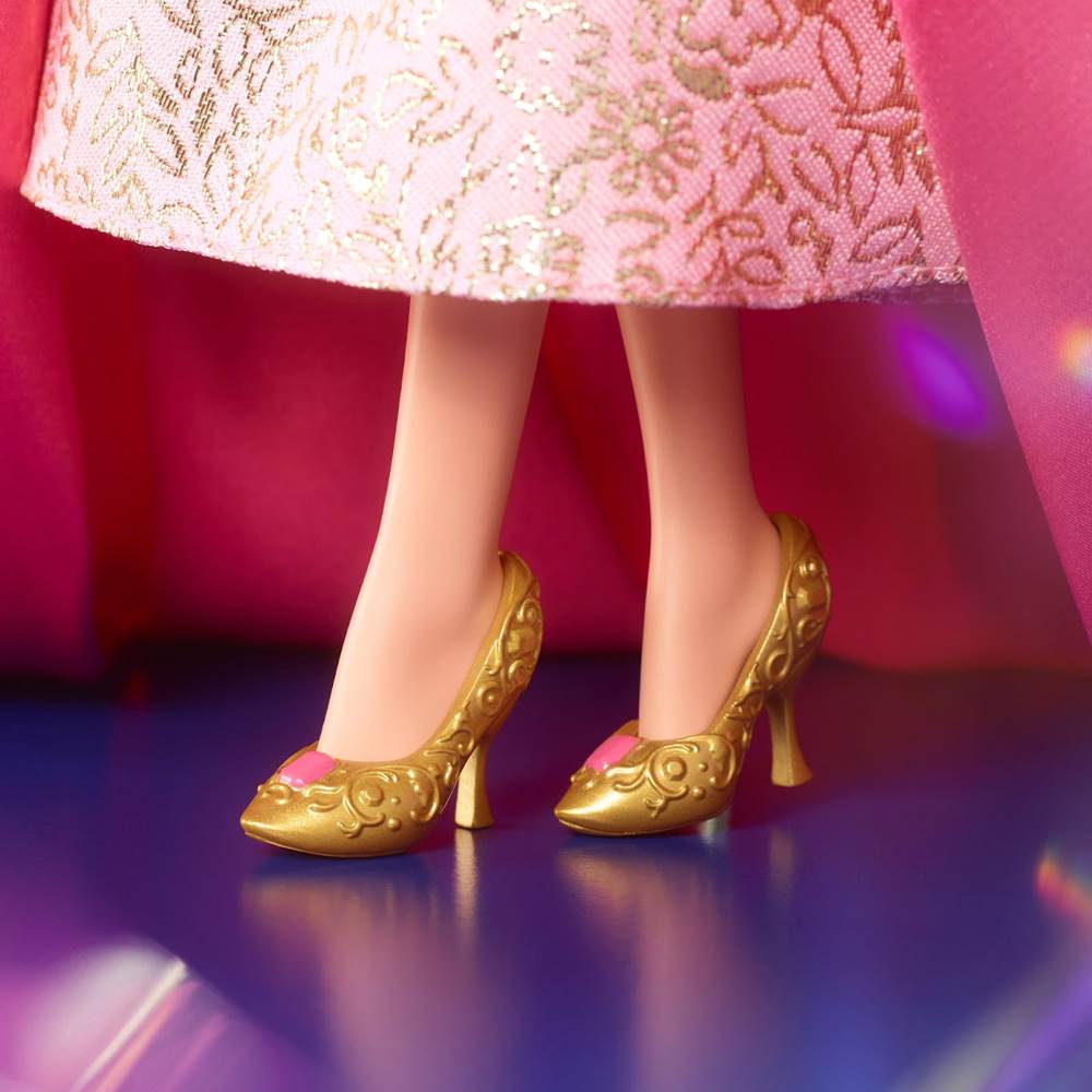 Golden high heel shoes are a charming hidden detail.