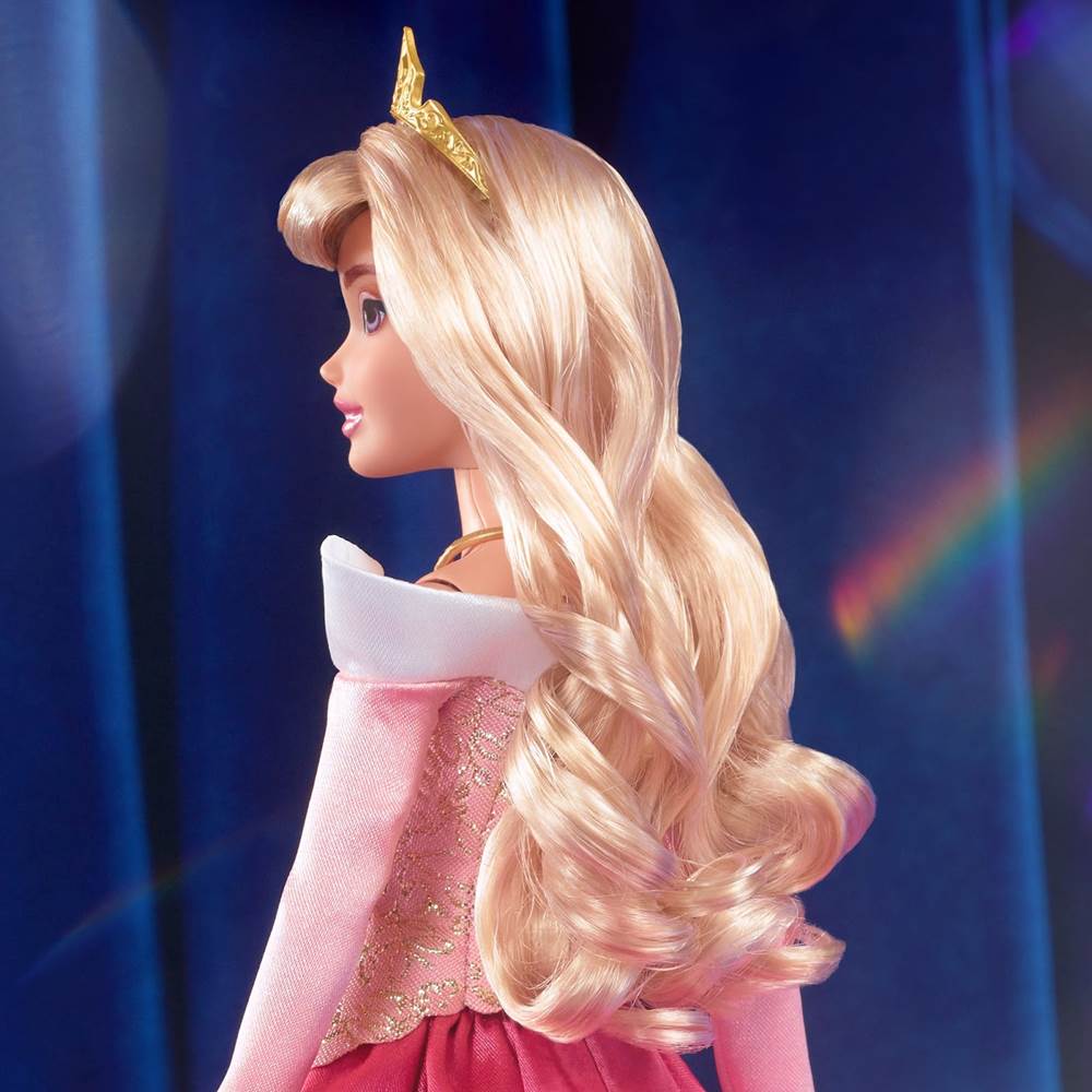 Aurora has long golden locks and a pretty gem-encrusted tiara