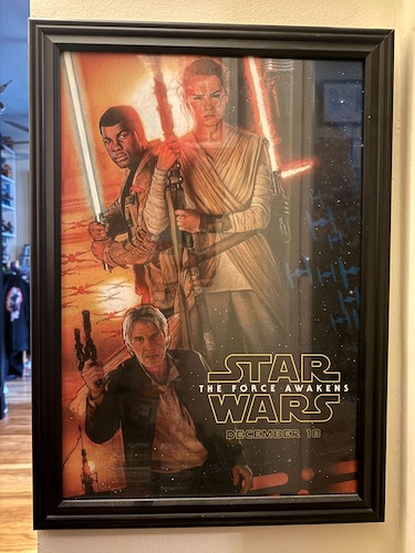 My framed D23-exclusive print of Drew Struzan's 'Star Wars: The Force Awakens' artwork.