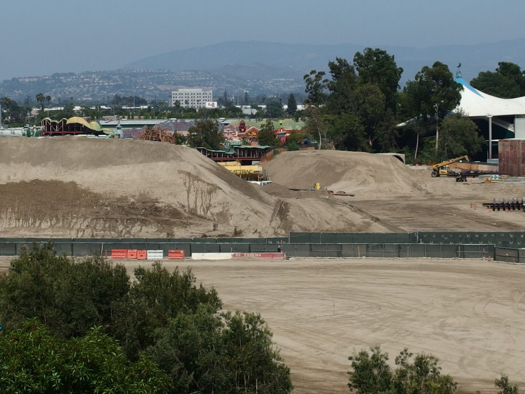 Toontown is just visible through the piles of dirt