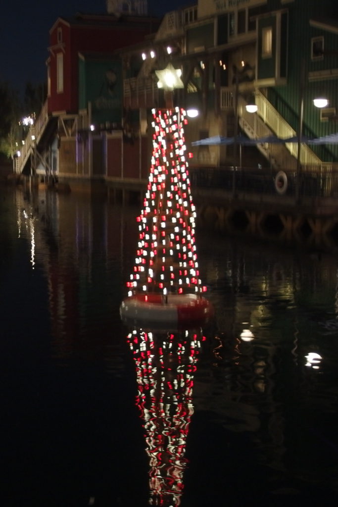 A tree decorates the waters near Pacific Wharf