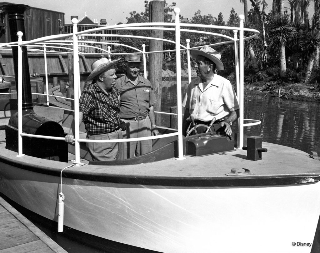 CREATING A JUNGLE –– Walt Disney (right) and Harper Goff (left) take a test ride on the Jungle Cruise. The Jungle Cruise opened with Disneyland park in 1955 and was later introduced at Walt Disney World Resort, Tokyo Disney Resort, and Hong Kong Disneyland Resort. (Disney)