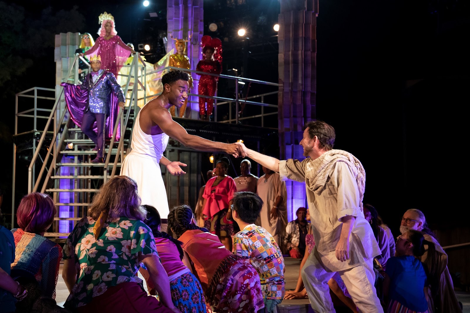 Jelani Alladin (center) and the company of The Public Theater’s free Public Works musical adaptation of Hercules, with music by Alan Menken, lyrics by David Zippel, book by Kristoffer Diaz, choreography by Chase Brock, and directed by Lear deBessonet, running at the Delacorte Theater. Photo credit: Joan Marcus.
