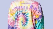 The back of a tie dye shirt that reads 'Epcot International Festival of the Arts 2019'