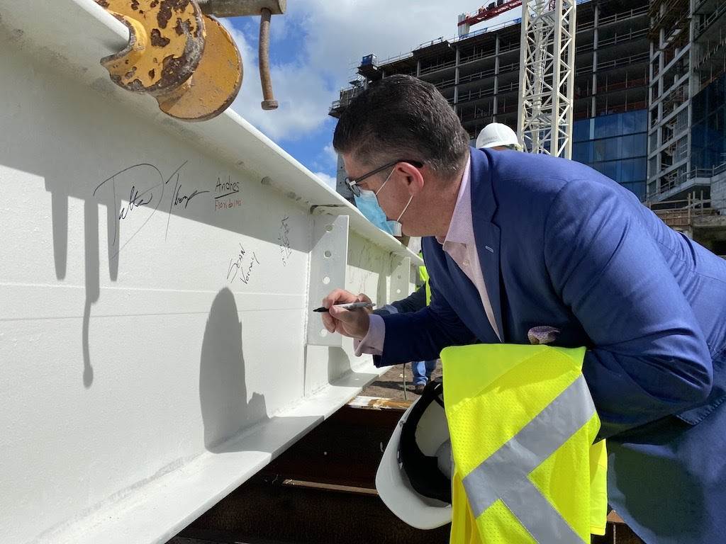 Sean Verney, general manager for the Walt Disney World Swan and Dolphin signs steel beam before installation 