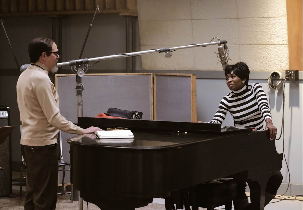 Music producer Jerry Wexler (L), played by David Cross, talks with Aretha Franklin, played by Cynthia Erivo, in the studio. (Credit: National Geographic/Richard DuCree)