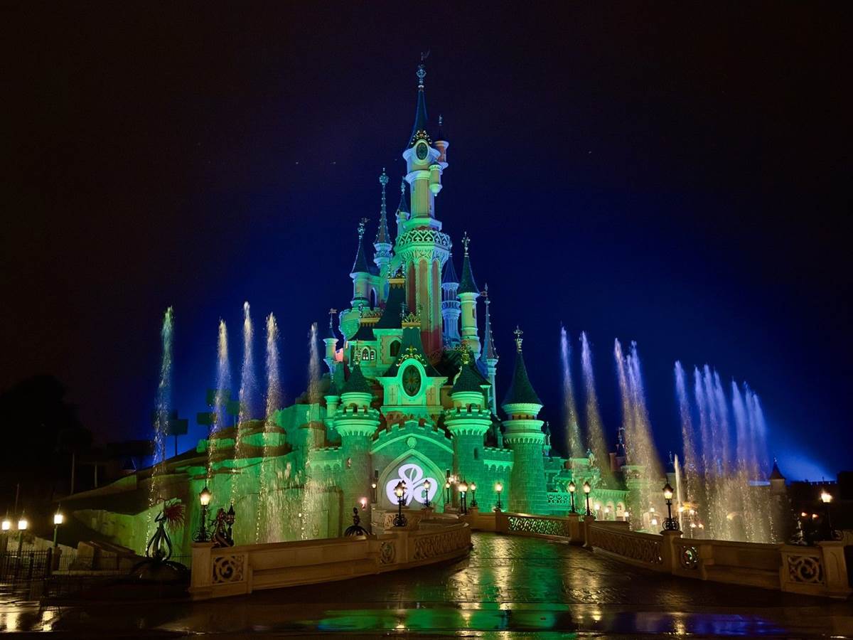 Disneyland Paris Lights Sleeping Beauty Castle in Green in Celebration of  St. Patrick's Day 