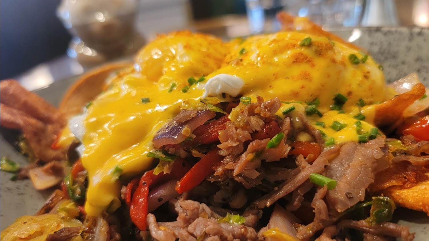 Magnificently soft cooked eggs under the hollandaise broke beautifully over the hearty ribeye hash. The thick cut potato chips while flavorful didn’t add to the dish due to their super crispy texture and had me wishing for traditional crispy diced potatoes.